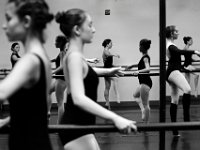 E class students are reflected in the mirror as they work on their Fondue exercises during barre workouts at the New Bedford Ballet studio on Purchast Street in the north end of New Bedford.   [ PETER PEREIRA/THE STANDARD-TIMES/SCMG ]